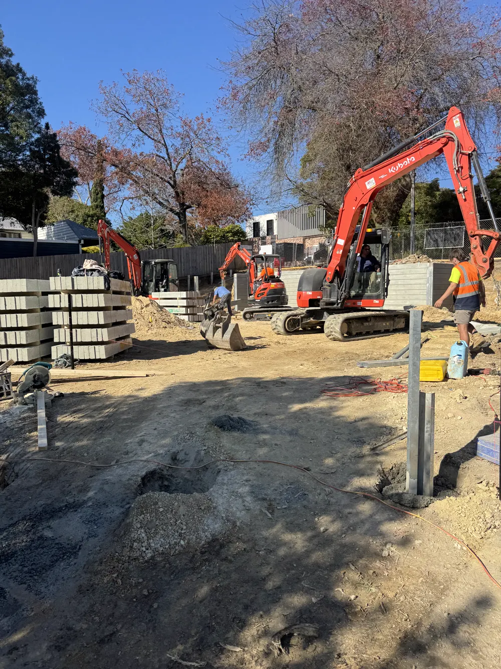 06 – Residential build, red excavator photo 2