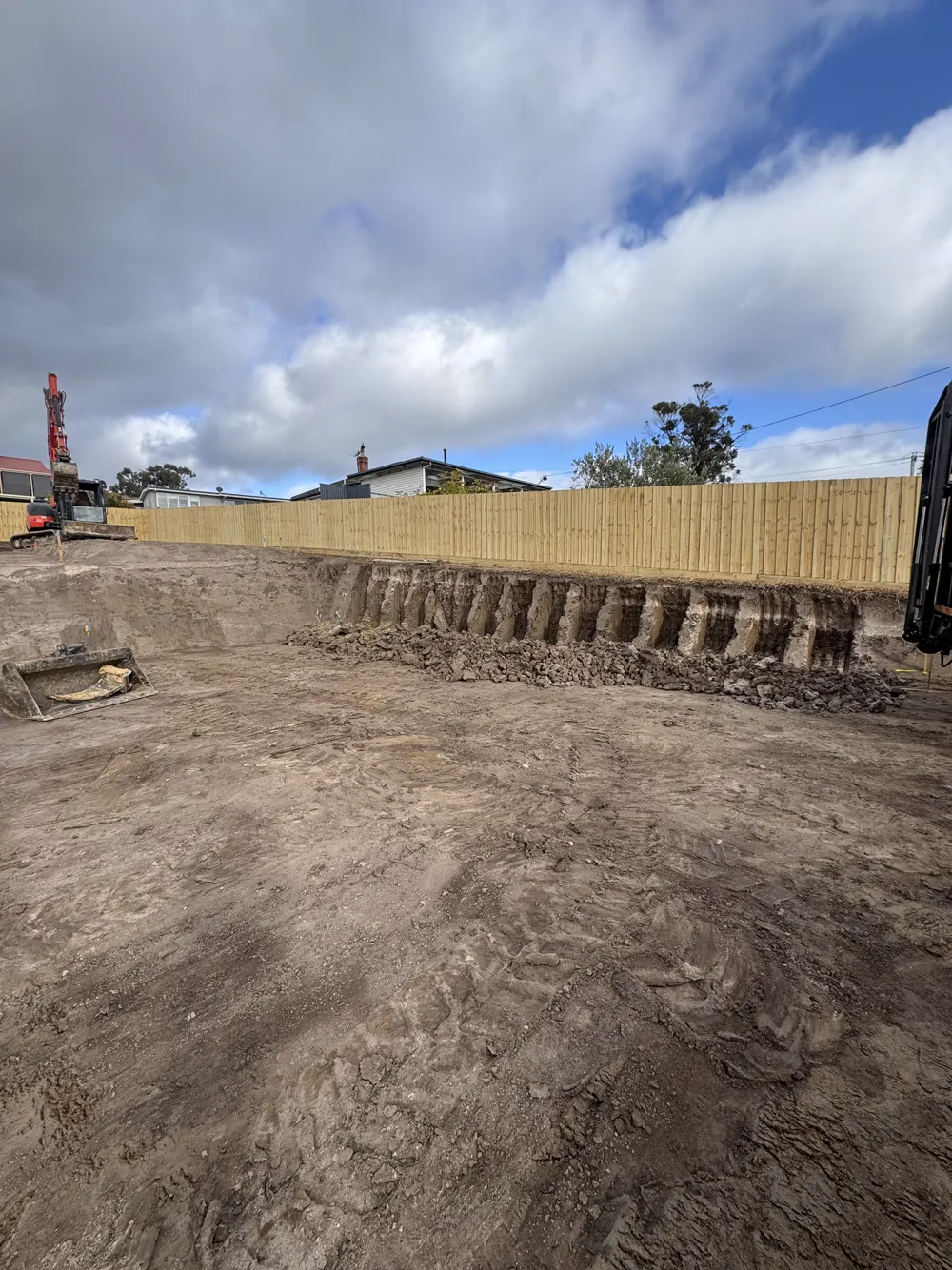 06 – Residential build, red excavator photo 3