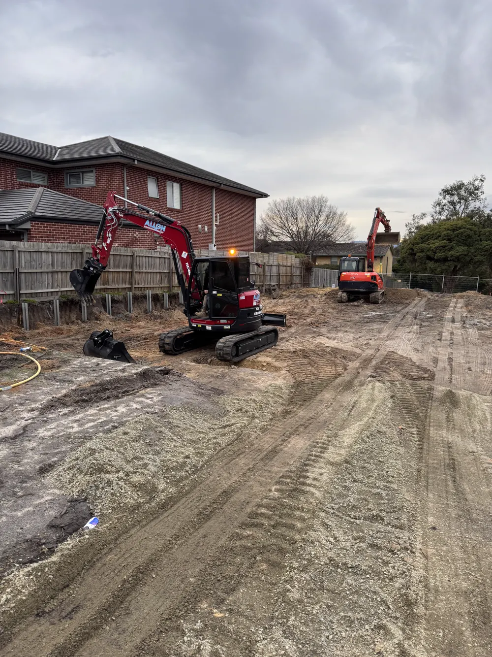 06 – Residential build, red excavator photo 4